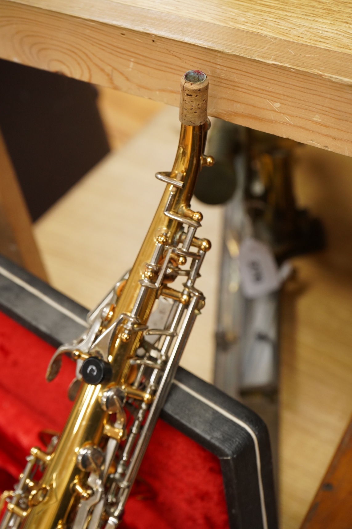 A cased Borgani soprano saxophone
